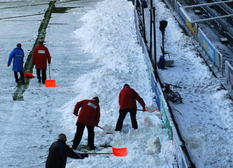 Groundsmen clearing Snow